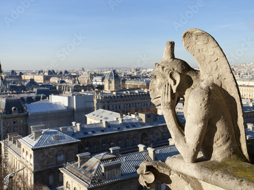 Notre Dame of Paris: Chimera overlooking the skyline of Paris