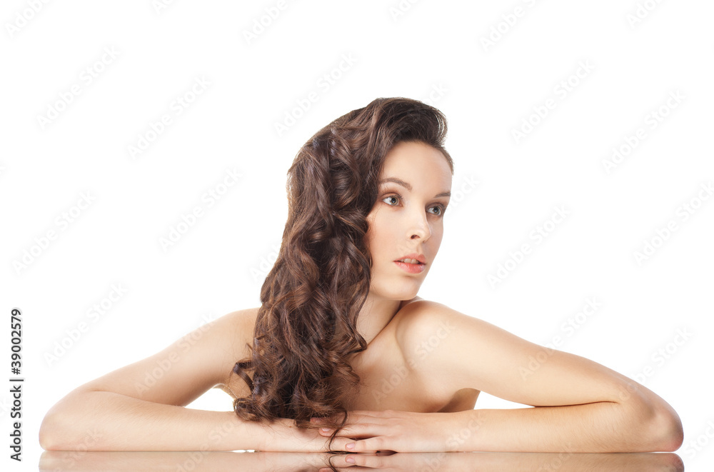 Obraz premium brunette woman with long wavy hairs on white