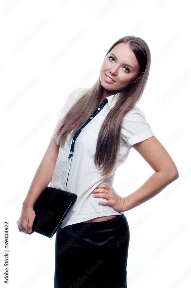 A beautiful young woman holding a closed laptop isolated on whit A beautiful young woman holding a closed laptop isolated on whit