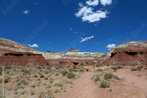 Coloured layered sanstone form hills in Utah desert
