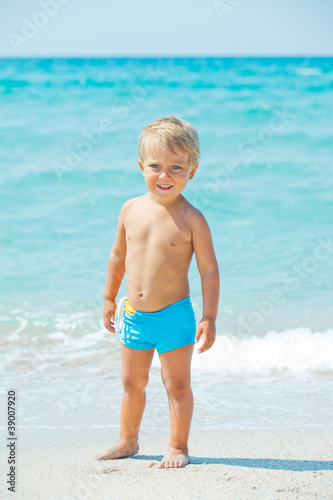 A cute boy with on the beach