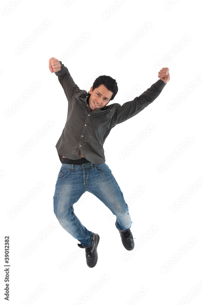 Happy young man jumping against white background.