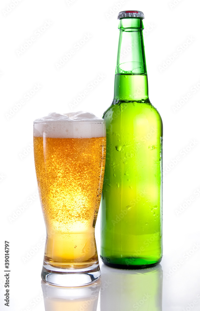 Beer in a green bottle and glass on a white background Beer in a green bottle and glass on a white background