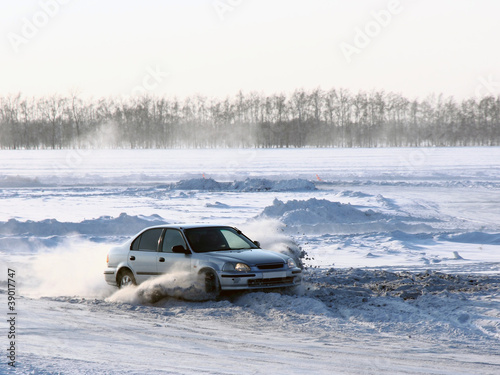 Car on winter road. © Arrows