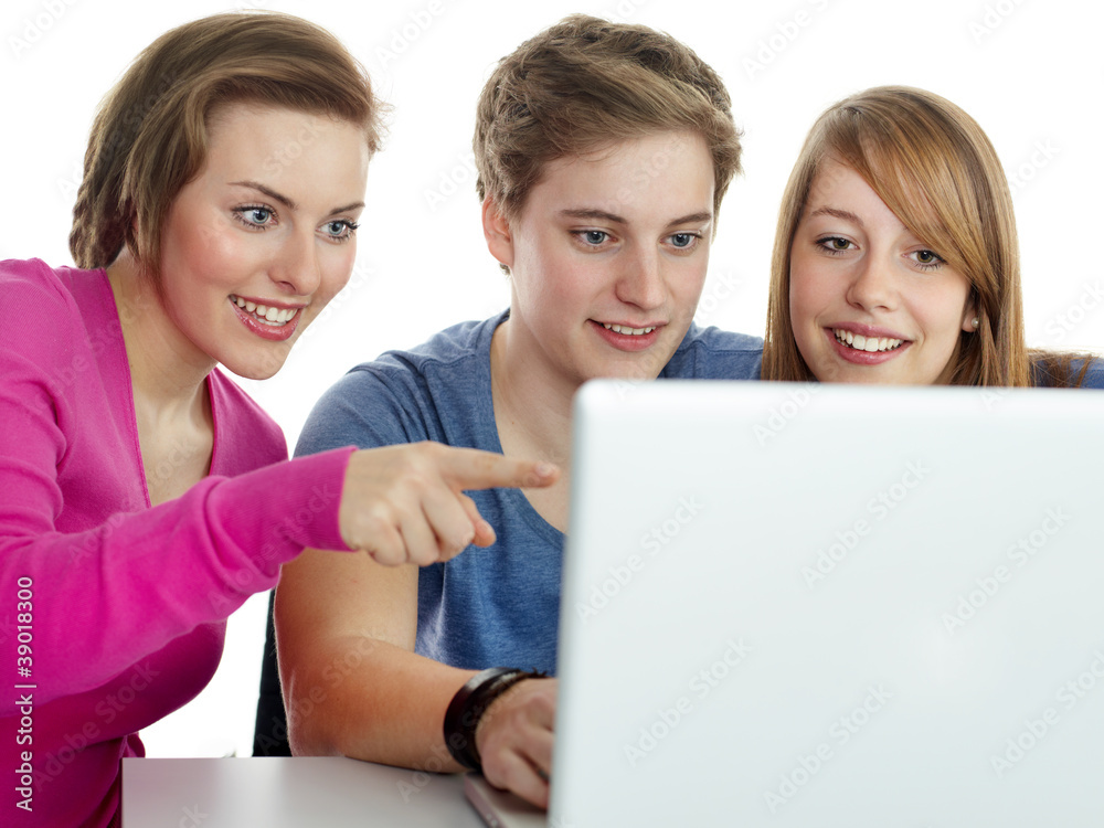 Three young students learning together with laptop Three young students learning together with laptop