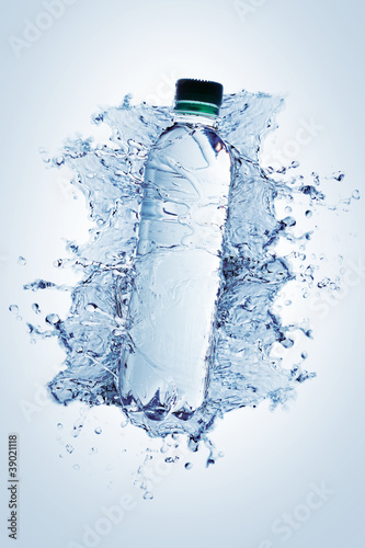 Bottle with pure water and splash around it