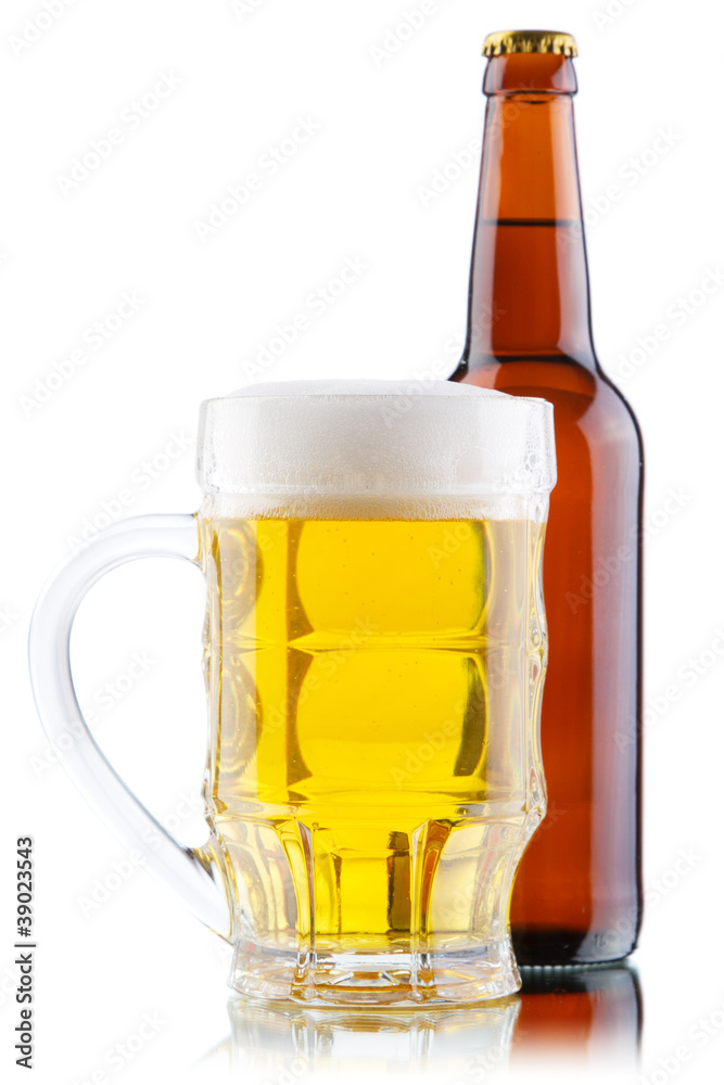 Beer mug and bottle isolated on white background