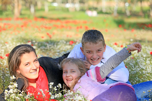 Mom with son and daughter in the park fooled photo