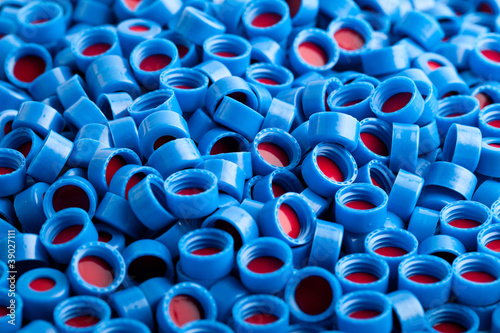 Blue and red plastic caps background photo