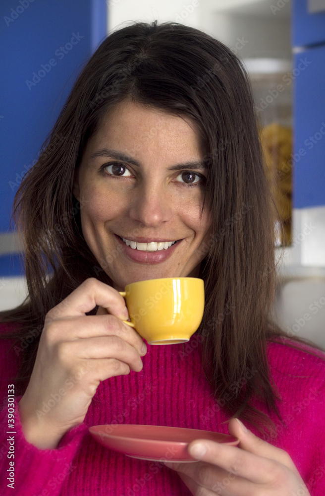 brunette smiling woman drinks a cup of coffee brunette smiling woman drinks a cup of coffee