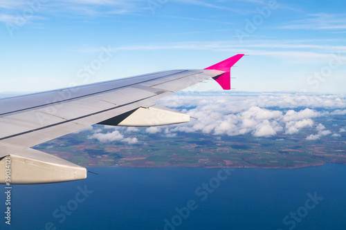 Aerial view of Ireland with plane wing