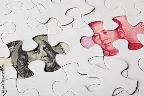 Canvas Print US and Chinese currencies as part of a jigsaw puzzle