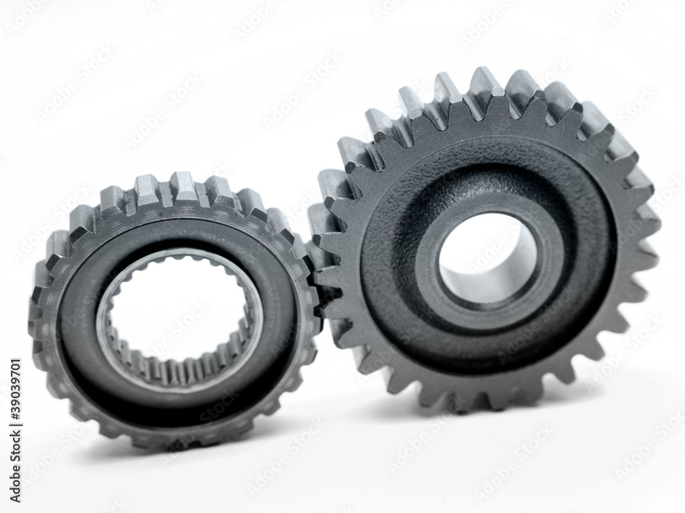 Two metal cogs working together teamwork Two metal cogs working together teamwork