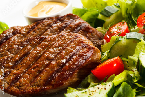 Grilled steaks and vegetables