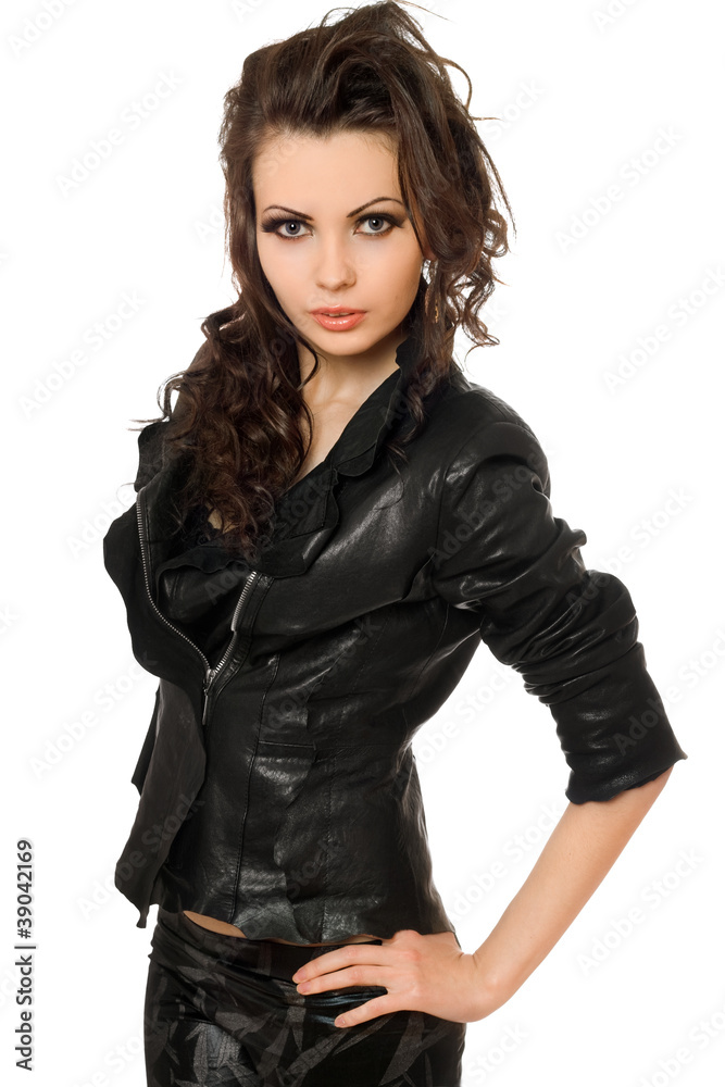Portrait of pretty young brunette in black clothes. Isolated Portrait of pretty young brunette in black clothes. Isolated