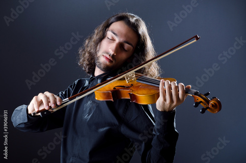 Young violin player playing