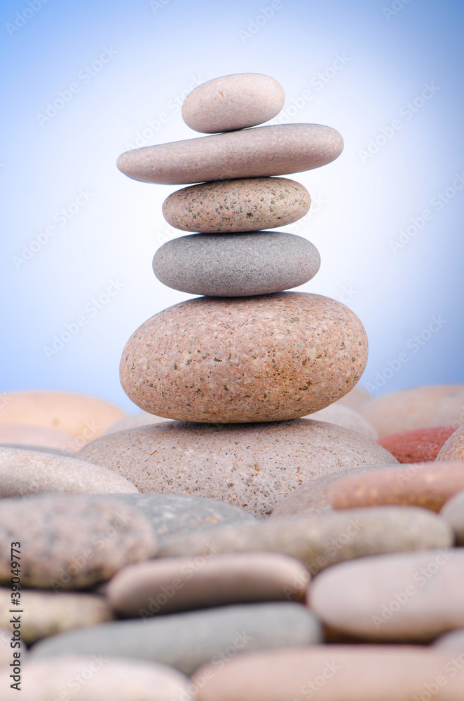 Pebbles stack against gradient background Pebbles stack against gradient background
