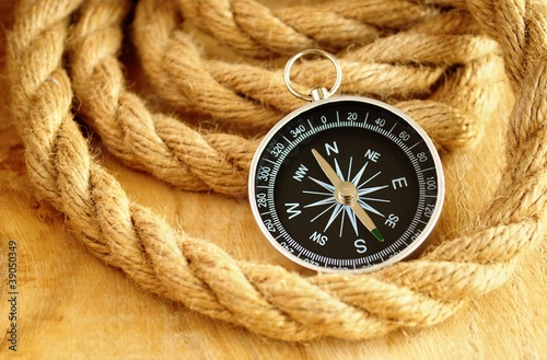 black compass and marine rope