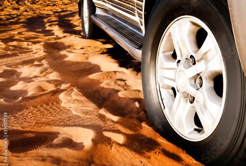 wheel of a car on the sand