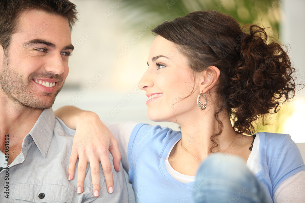 Affectionate young couple on couch Affectionate young couple on couch