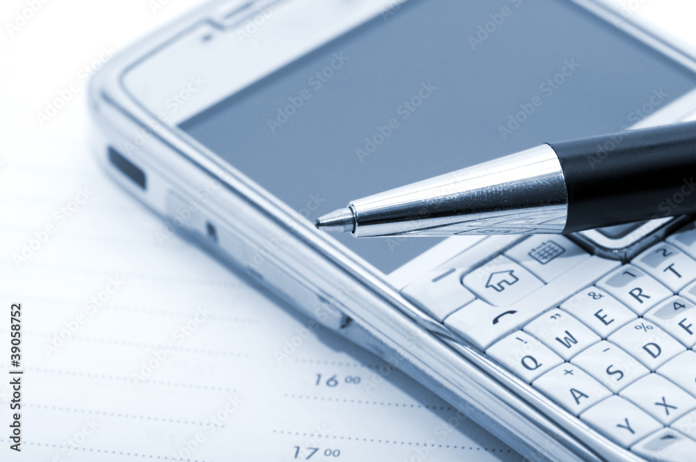 Pen, mobile phone and planner Pen, mobile phone and planner