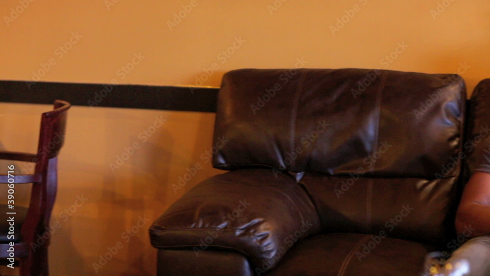 Couple kissing on the couch