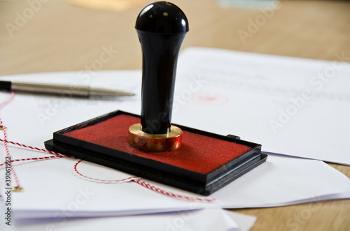 Stamp that is used by a notary public and signed document photo