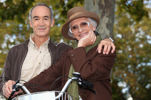 Older couple with a bicycle © auremar