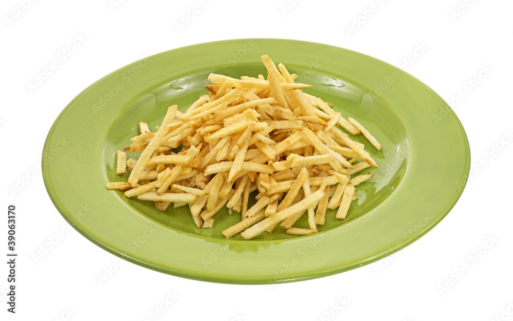 Shoestring potatoes on green plate