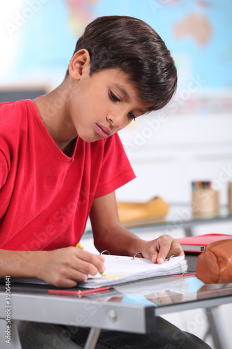 A young Latino studying.