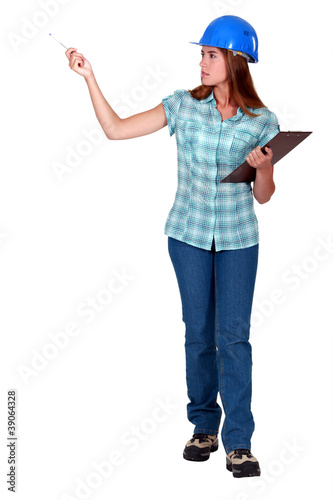 A female foreman with a clipboard.