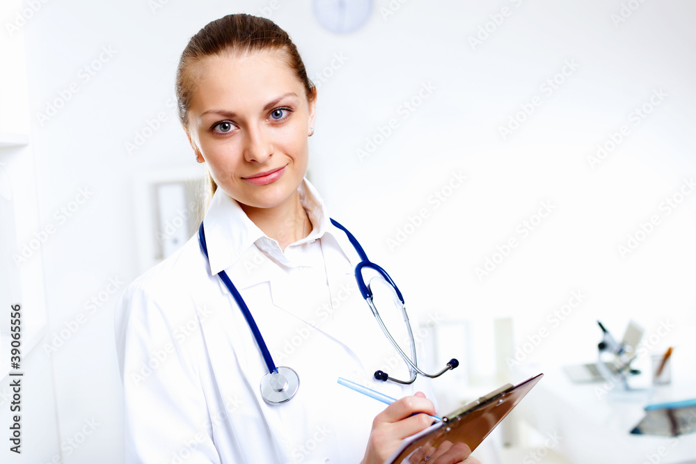 Friendly doctor in medical office Friendly doctor in medical office