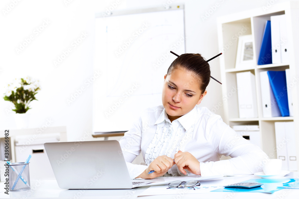 Young beautiful woman in business wear at work Young beautiful woman in business wear at work