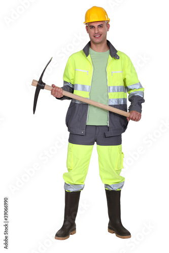 Worker holding pick-axe