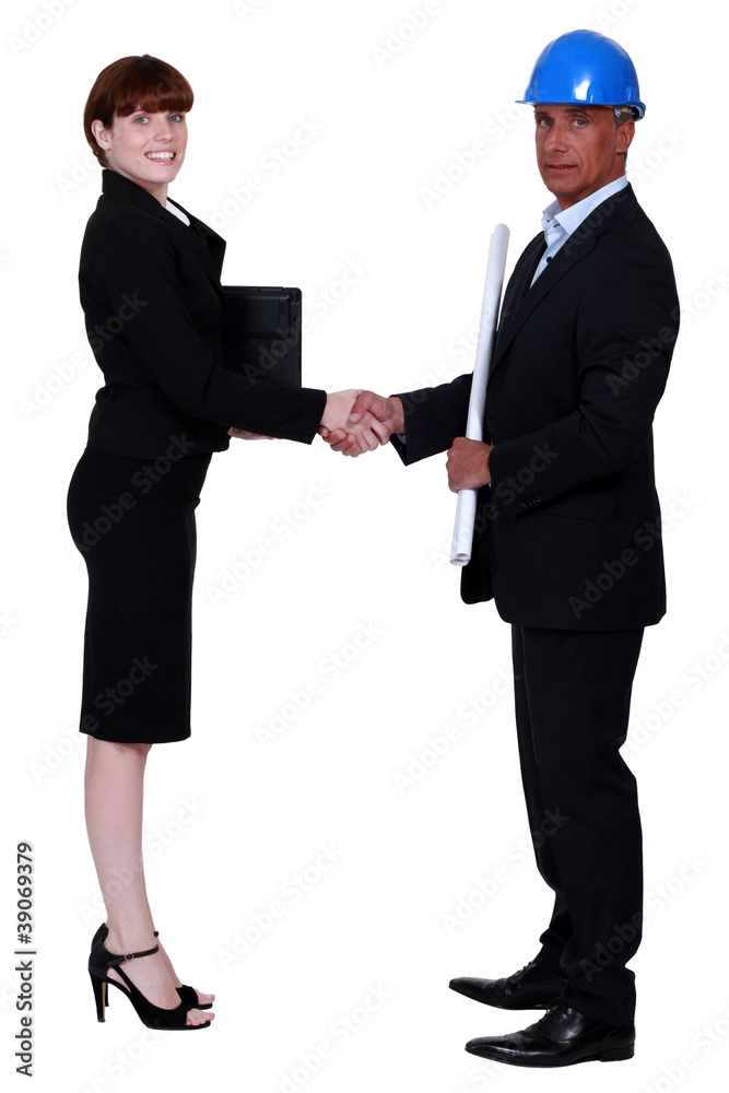 businesswoman and real estate businessman shaking hands businesswoman and real estate businessman shaking hands