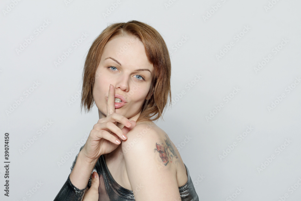 portrait of attractive girl with finger on lips,isolated portrait of attractive girl with finger on lips,isolated