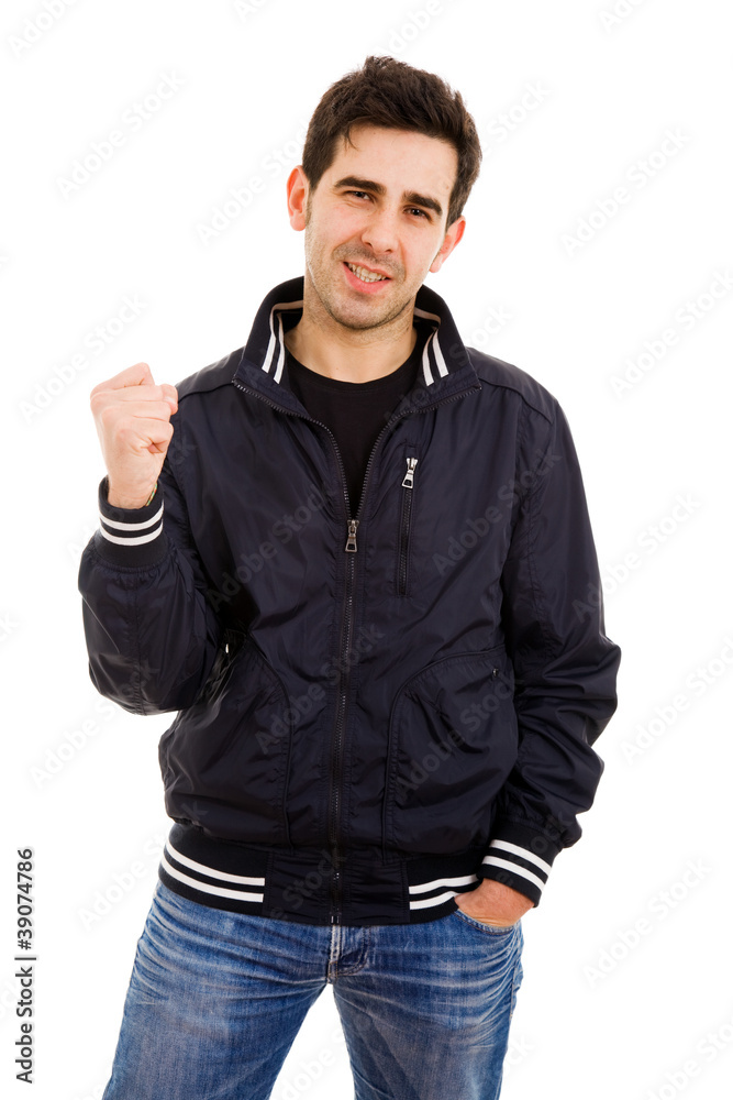 portrait of young man winner gesture against a white background portrait of young man winner gesture against a white background