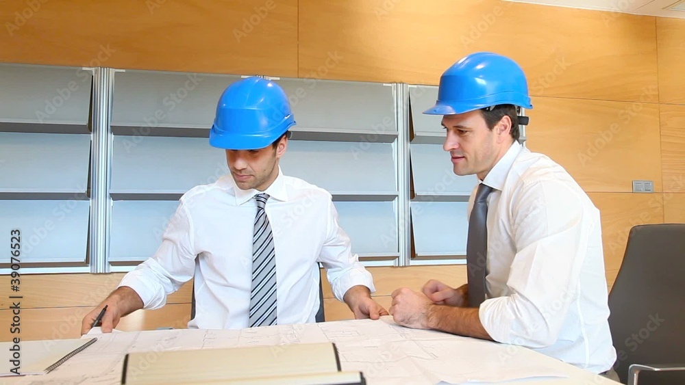 Team of architects working on construction plan
