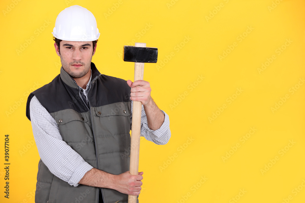 A construction worker with a sledgehammer.