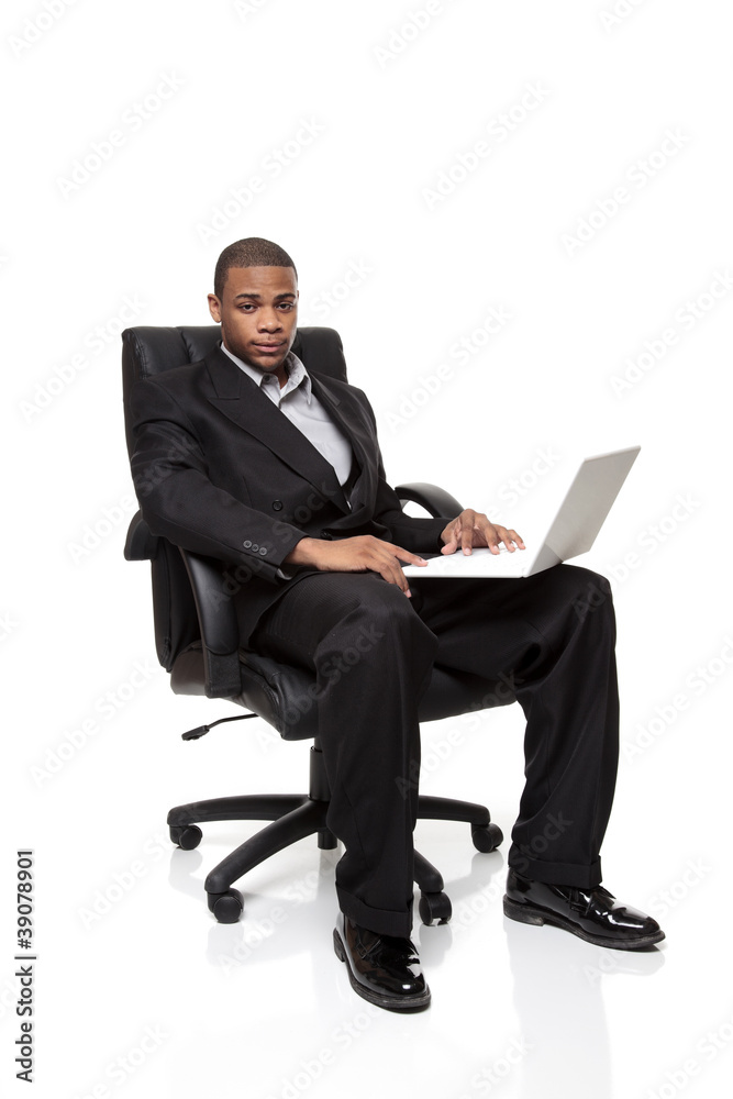 African American businessman sitting in chair with laptop African American businessman sitting in chair with laptop