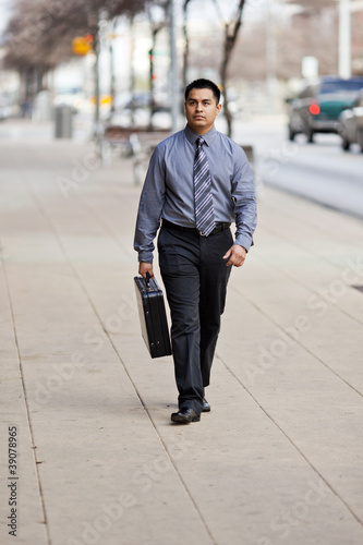 Hispanic Businessman - Walking Downtown With Briefcase