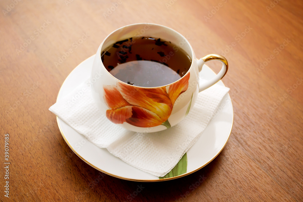 porcelain teacup and saucer on a wooden table porcelain teacup and saucer on a wooden table