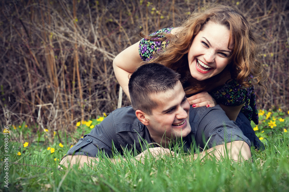 Happy couple having fun on grass