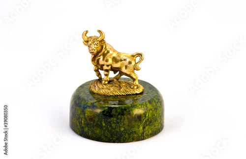Bronze bull on green stone pedestal