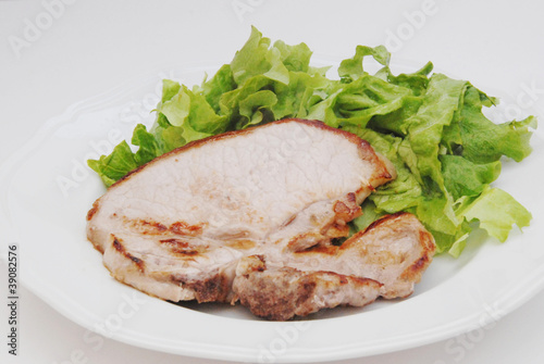 braciola di suino con insalata photo