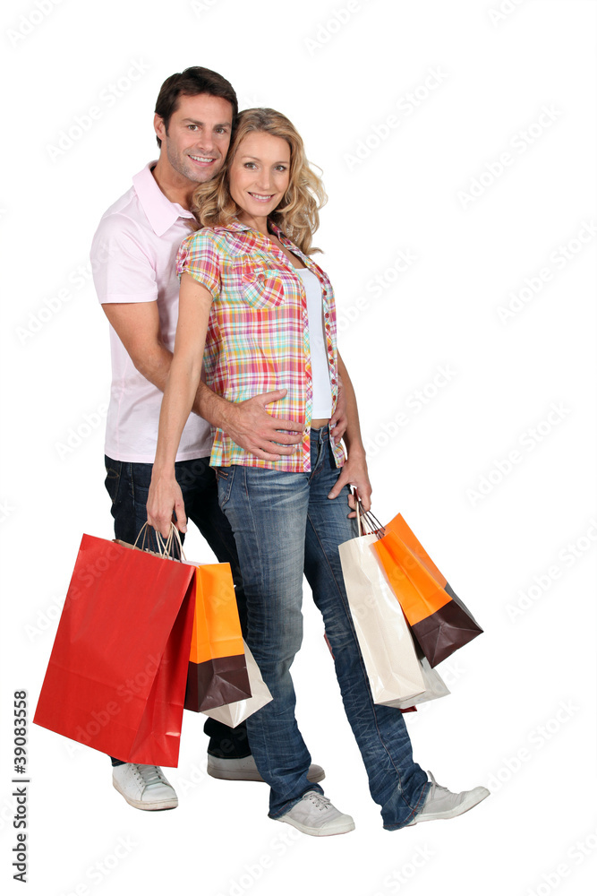 couple with shopping bags couple with shopping bags