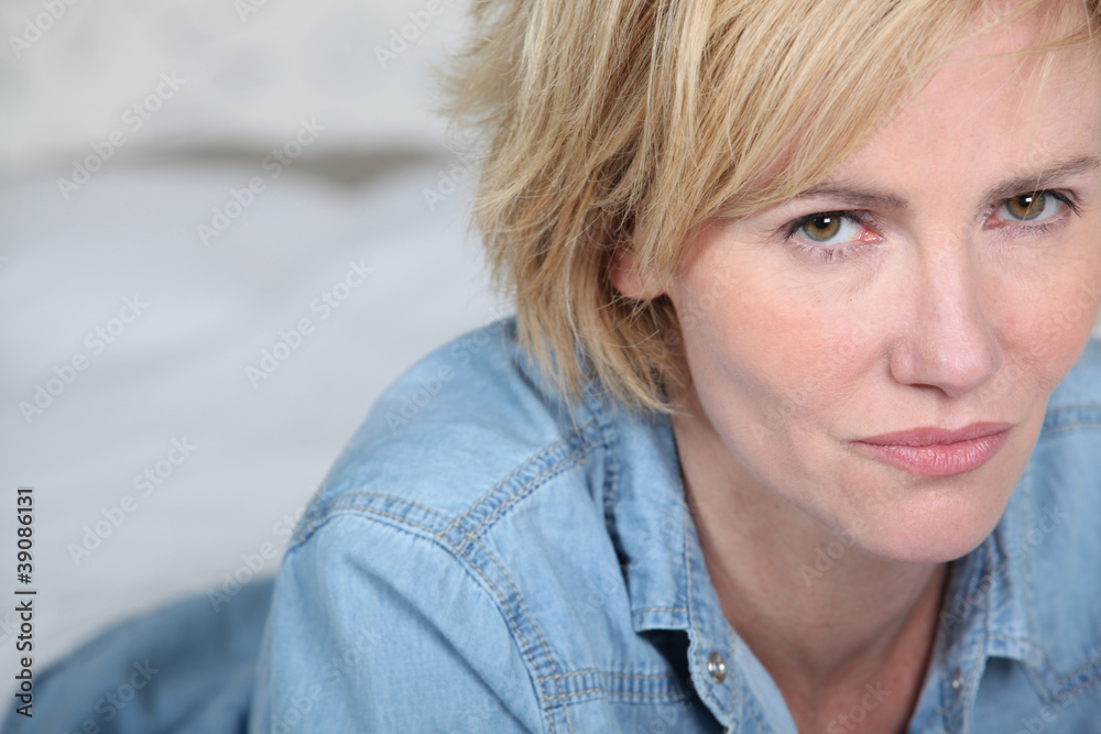 Landscape of blonde woman wearing denim shirt Landscape of blonde woman wearing denim shirt