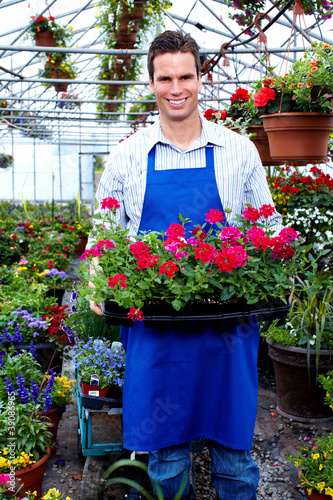 Florist man working with flowers.