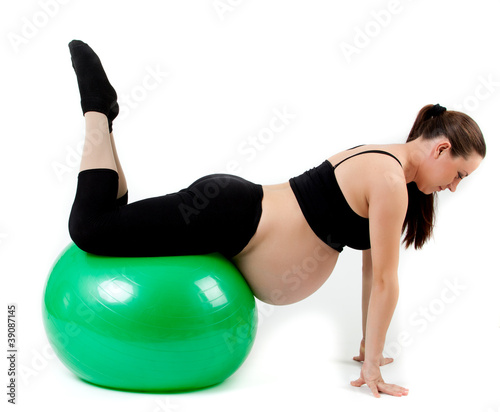 Fototapeta Naklejka Na Ścianę i Meble -  Pregnant woman excercises with gymnastic ball. Beautiful pregnan