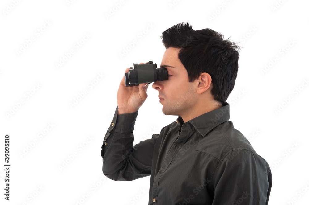 Young man looks through binoculars. Young man looks through binoculars.